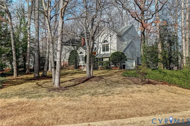 a view of a lake with a house in the background