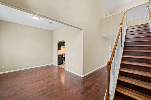 a view of an entryway with wooden floor