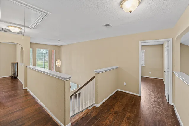 a view of an entryway with wooden floor