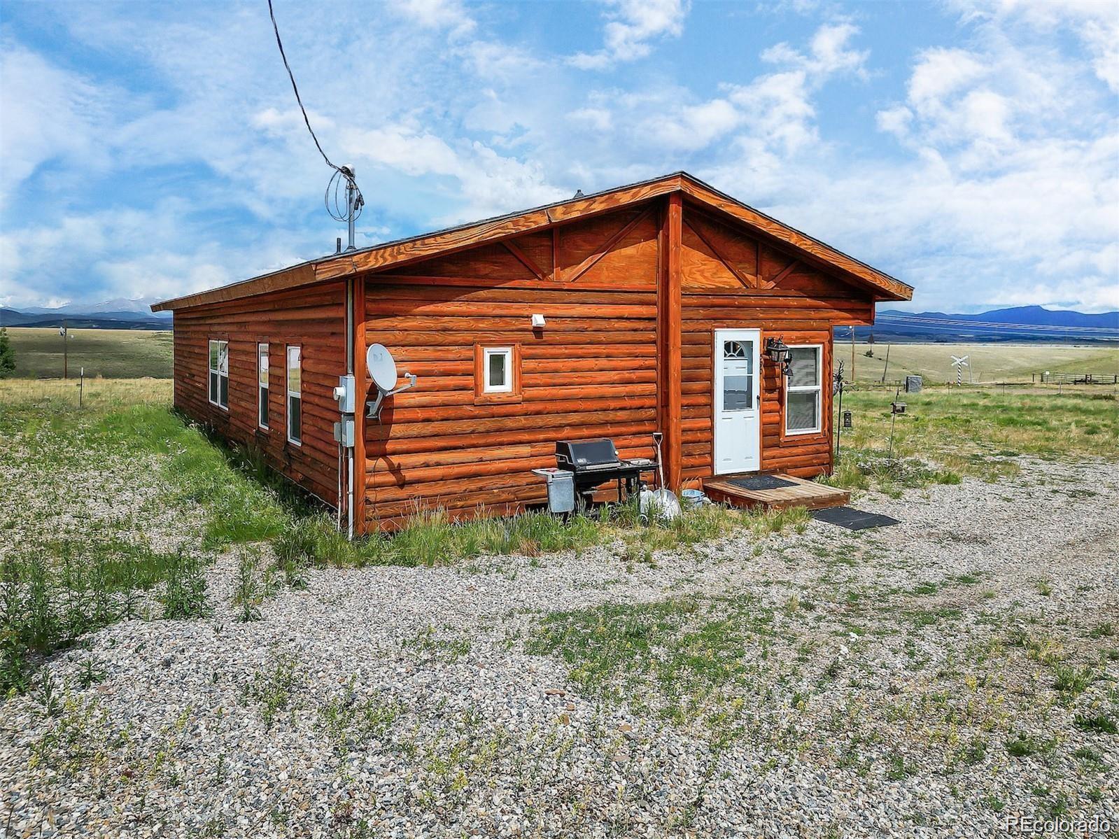 75 6th Street Como, CO 80432 - Photo 31 of 33 a front view of house with yard