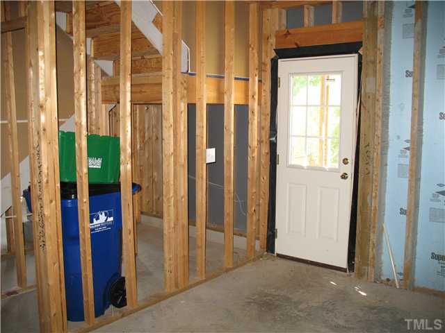 7409 Brandon Allen Avenue Raleigh, NC 27613 - Photo 12 of 14 Framed unfinished basement with exterior access.
