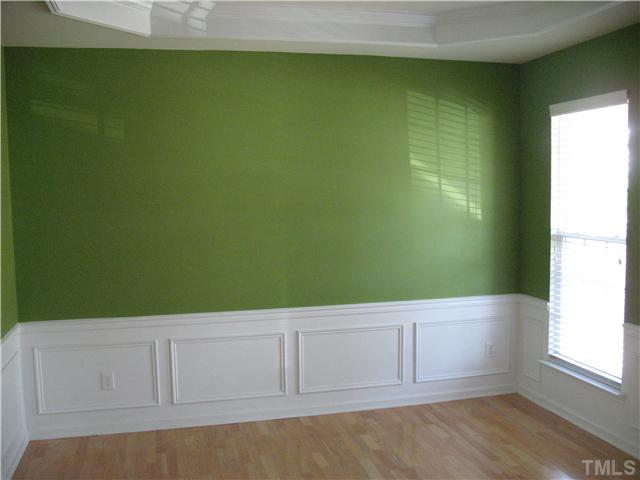 7409 Brandon Allen Avenue Raleigh, NC 27613 - Photo 3 of 14 Dining room with trey ceiling and hardwood floors.