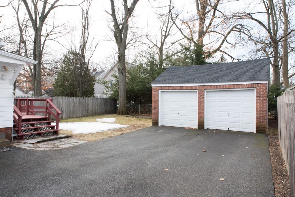 134 Draper Street Springfield, MA 01108 - Photo 3 of 23 a car parked in front of house