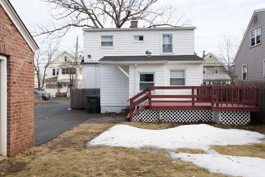 134 Draper Street Springfield, MA 01108 - Photo 4 of 23 a front view of a house with a yard