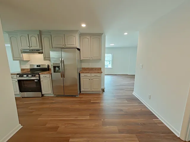 a view of a porch with wooden floor and roof