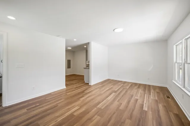 a view of a porch with wooden floor
