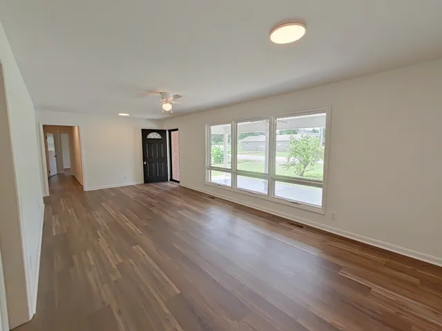 a kitchen with a sink stainless steel appliances and cabinets