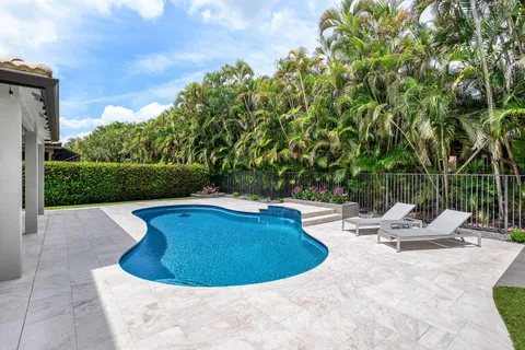 a view of a backyard with sitting area