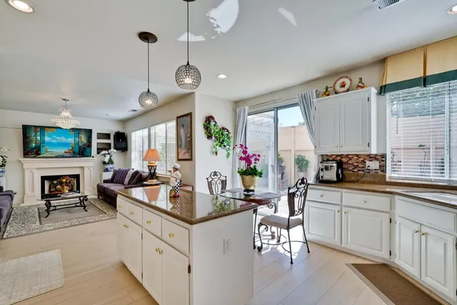 a view of a living room and kitchen