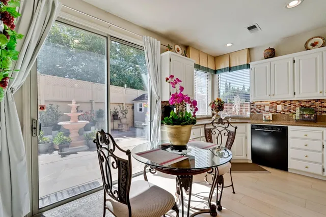 a living room with furniture flat screen tv and a fireplace