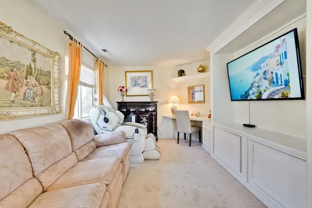 a kitchen with white cabinets and a sink