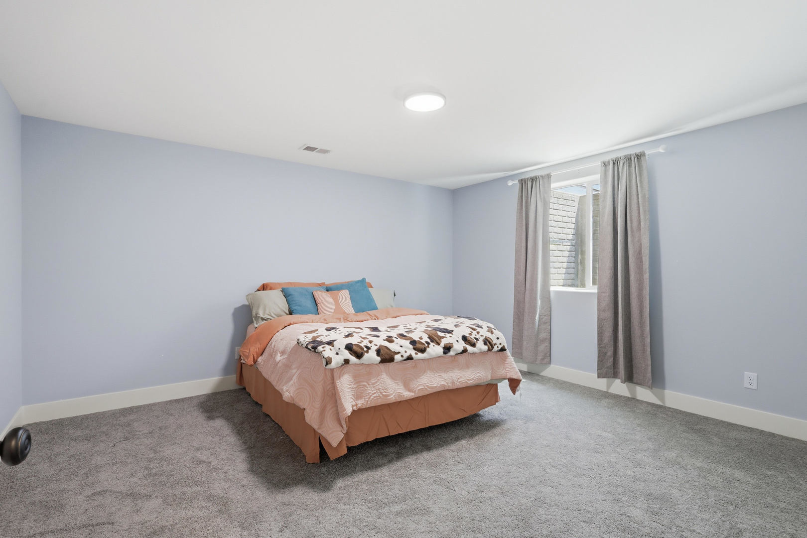 6779 Genesis Way Bettendorf, IA 52722 - Photo 30 of 36 a bed sitting in a bedroom next to a window