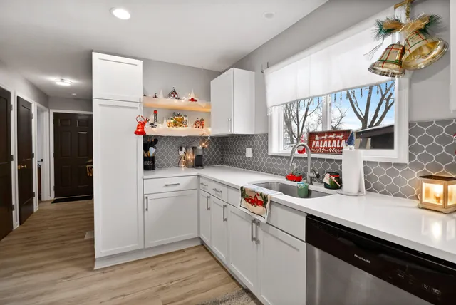 a bathroom with a toilet sink a mirror and vanity
