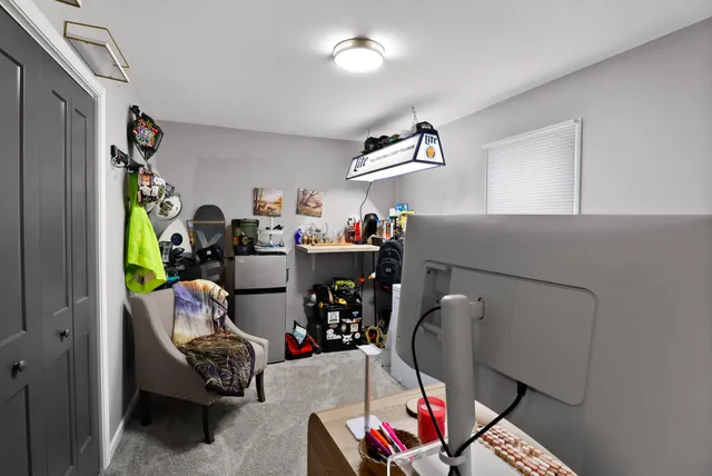 a bedroom with a bed and flat screen tv