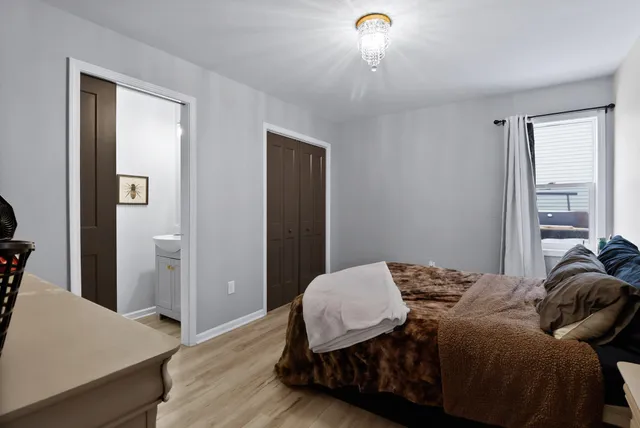 a view of a bathroom with a sink and a mirror