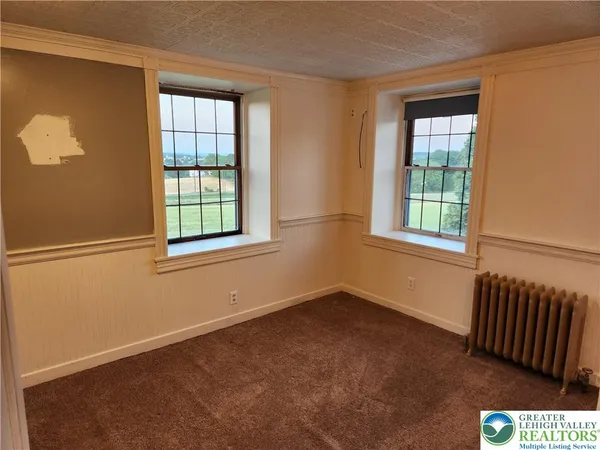 an empty room with windows