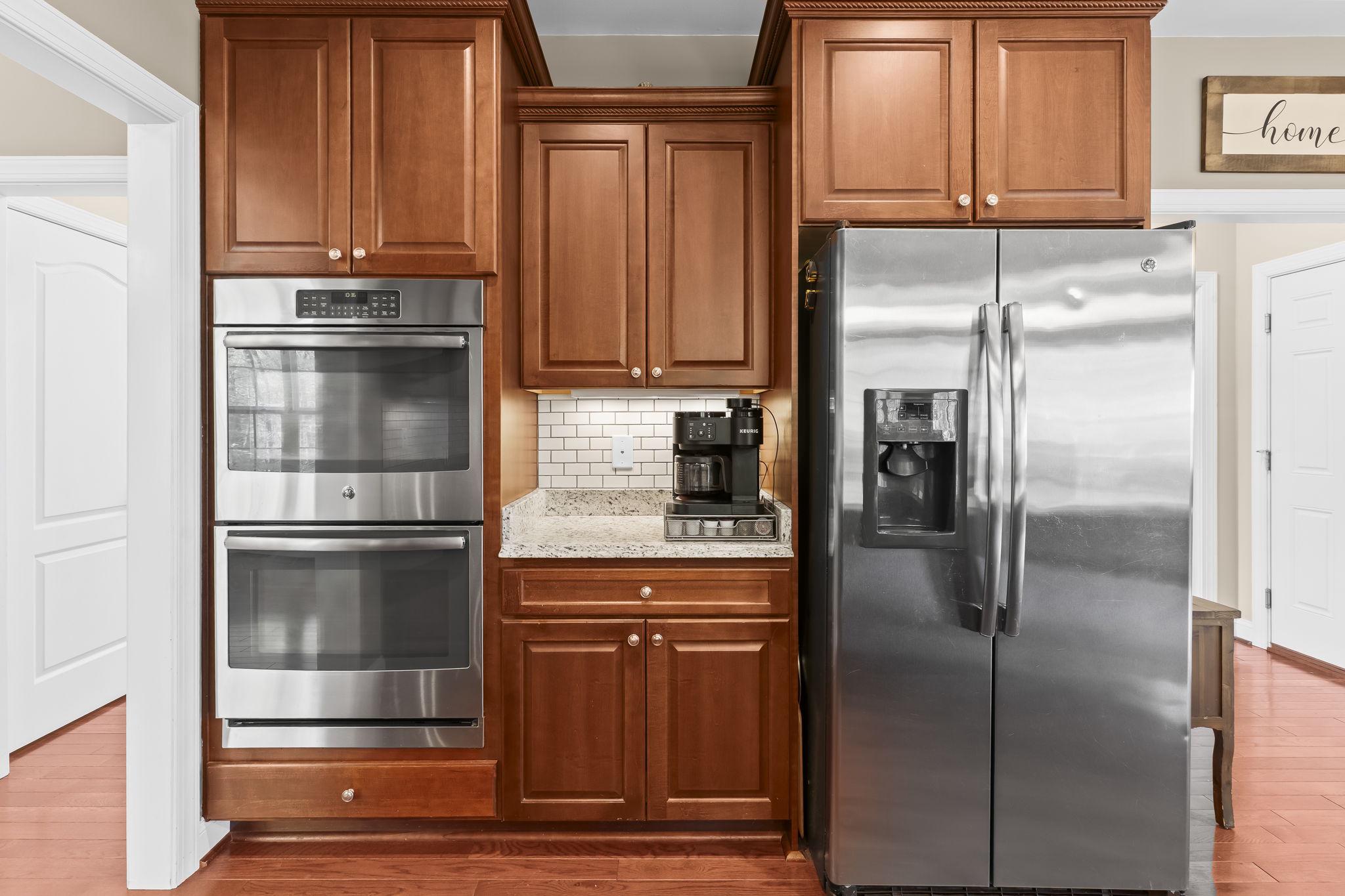 1905 Resting Ridge Lane Prince Frederick, MD 20678 - Photo 19 of 91 a kitchen with stainless steel appliances granite countertop a refrigerator and a stove