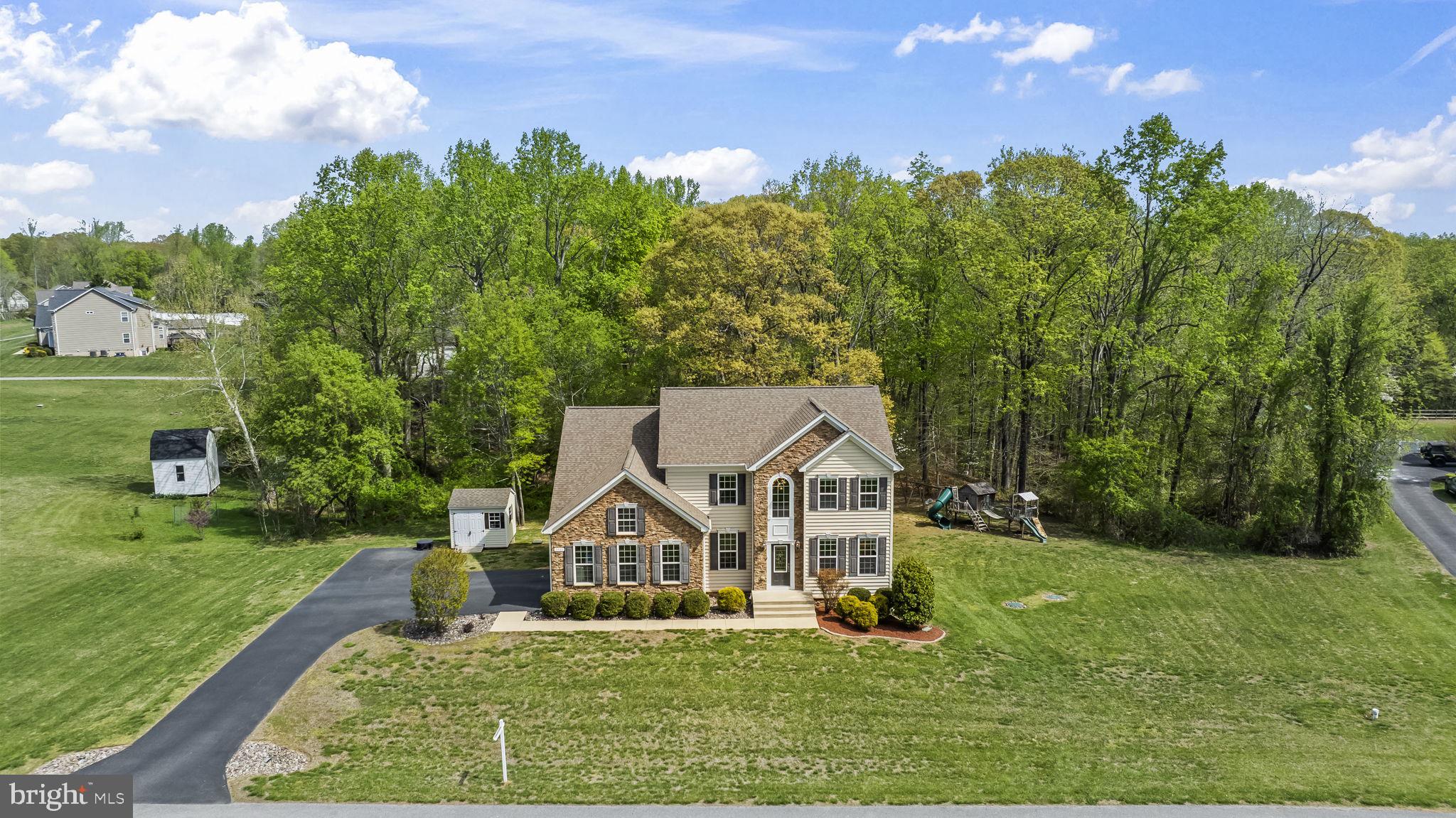 1905 Resting Ridge Lane Prince Frederick, MD 20678 - Photo 2 of 91 a front view of a house with a yard