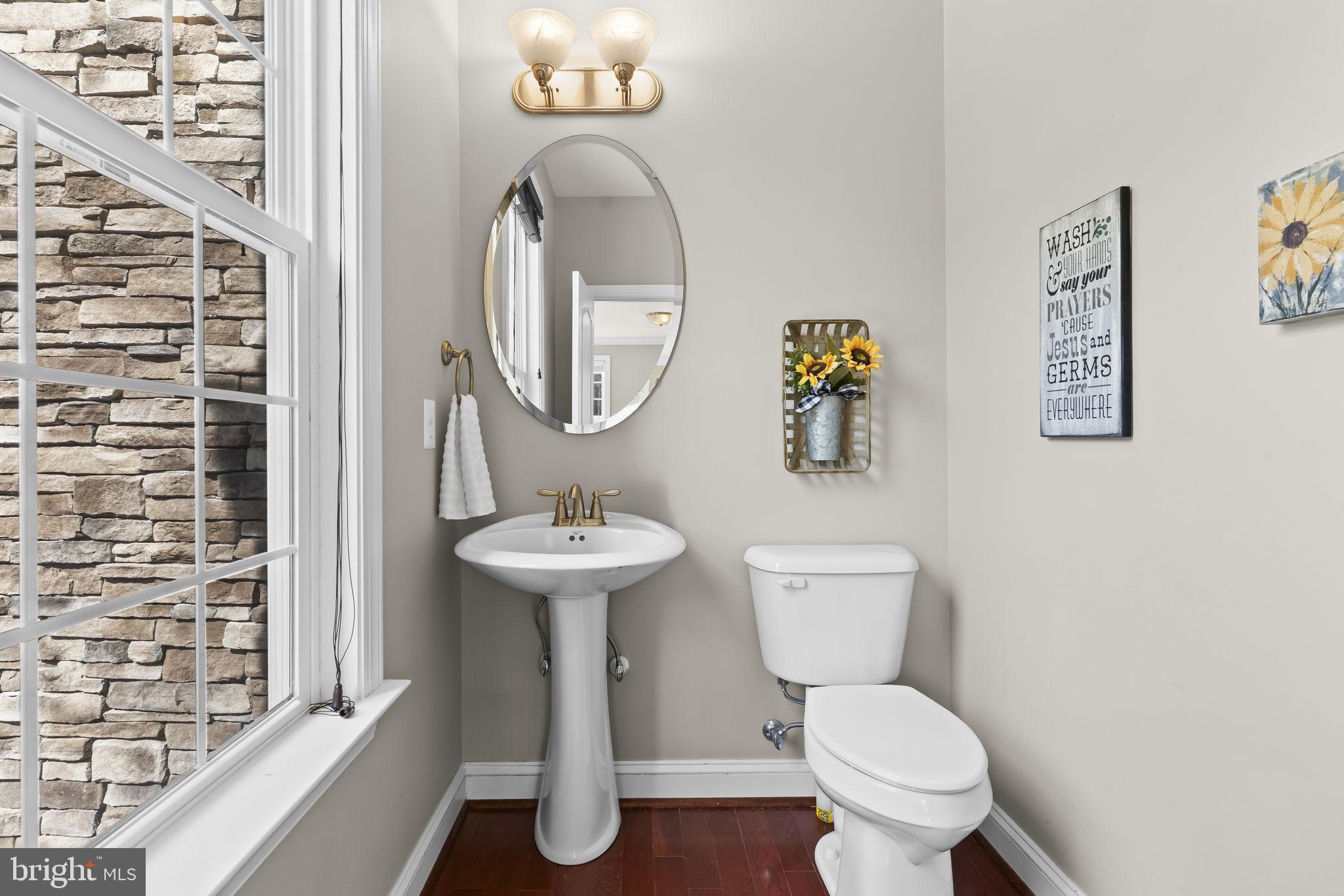1905 Resting Ridge Lane Prince Frederick, MD 20678 - Photo 25 of 91 a bathroom with a toilet and a sink