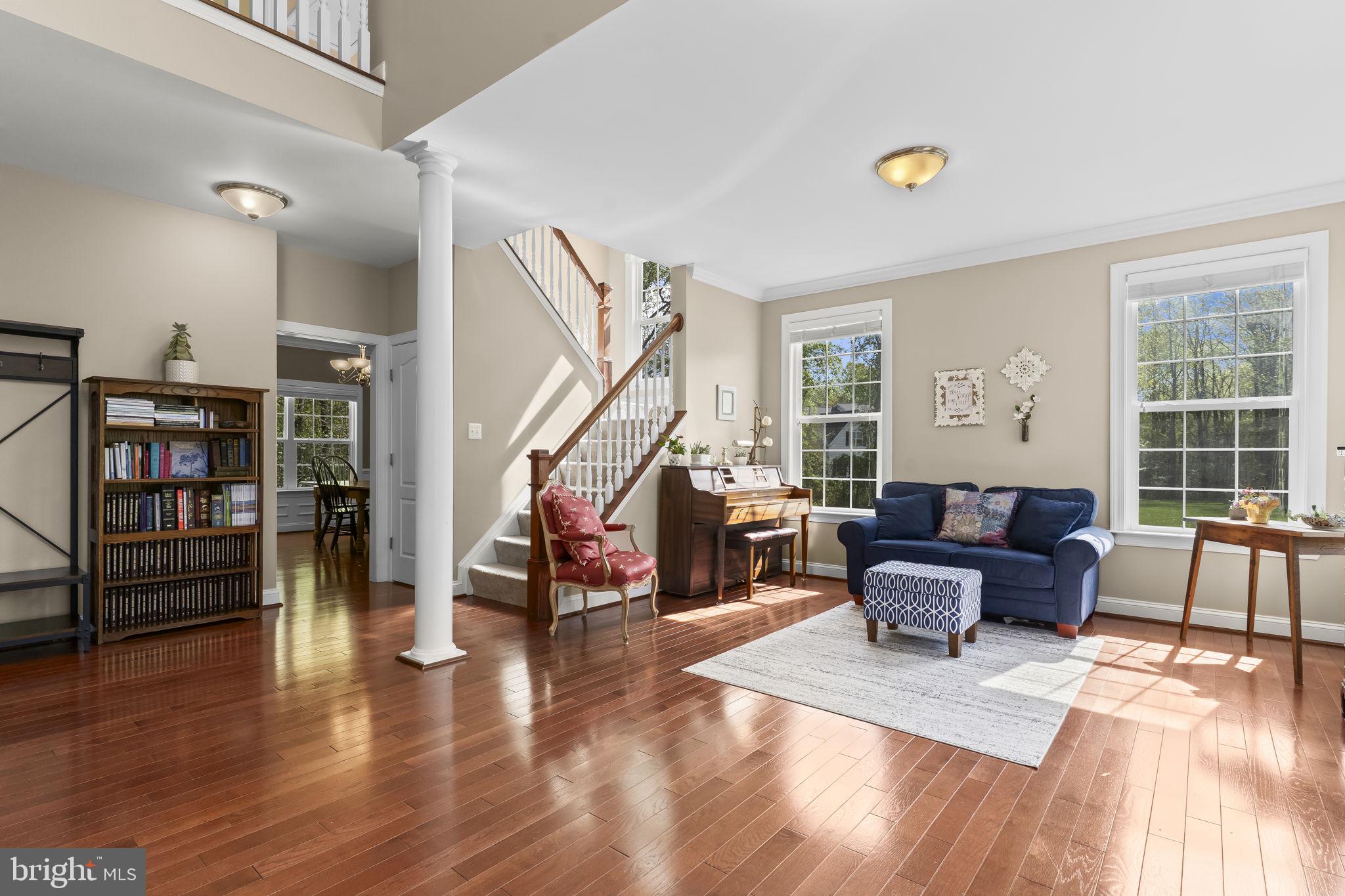 1905 Resting Ridge Lane Prince Frederick, MD 20678 - Photo 4 of 91 a living room with furniture and a wooden floor