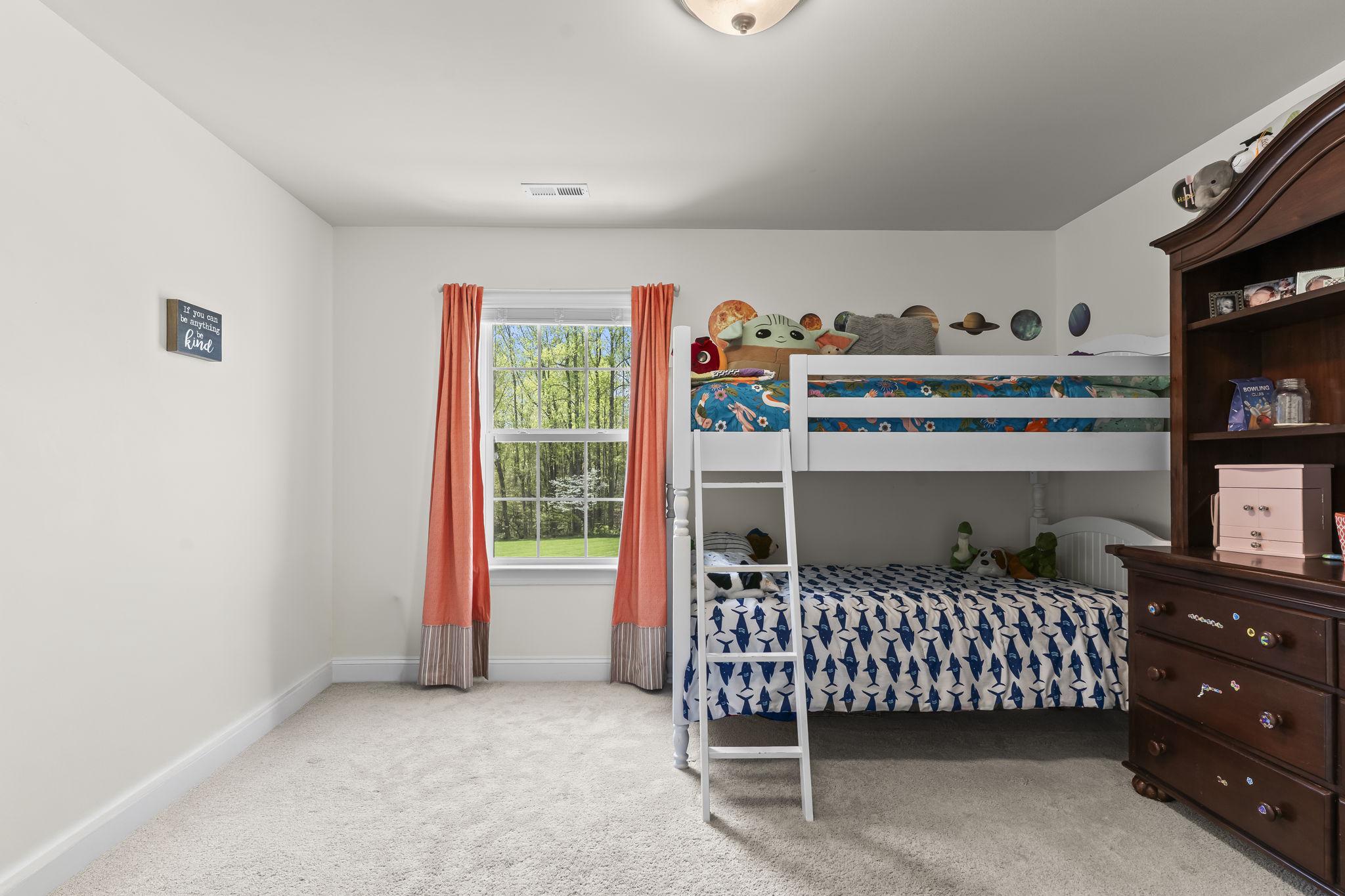 1905 Resting Ridge Lane Prince Frederick, MD 20678 - Photo 42 of 91 a bedroom with a bed and a window