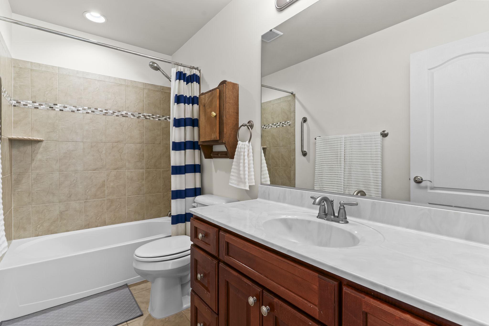 1905 Resting Ridge Lane Prince Frederick, MD 20678 - Photo 46 of 91 a bathroom with a granite countertop sink toilet and shower