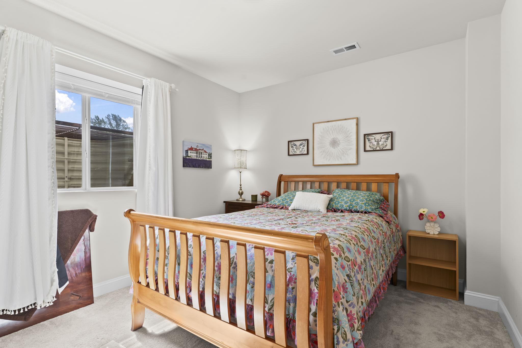 1905 Resting Ridge Lane Prince Frederick, MD 20678 - Photo 52 of 91 a bedroom with a bed and a window