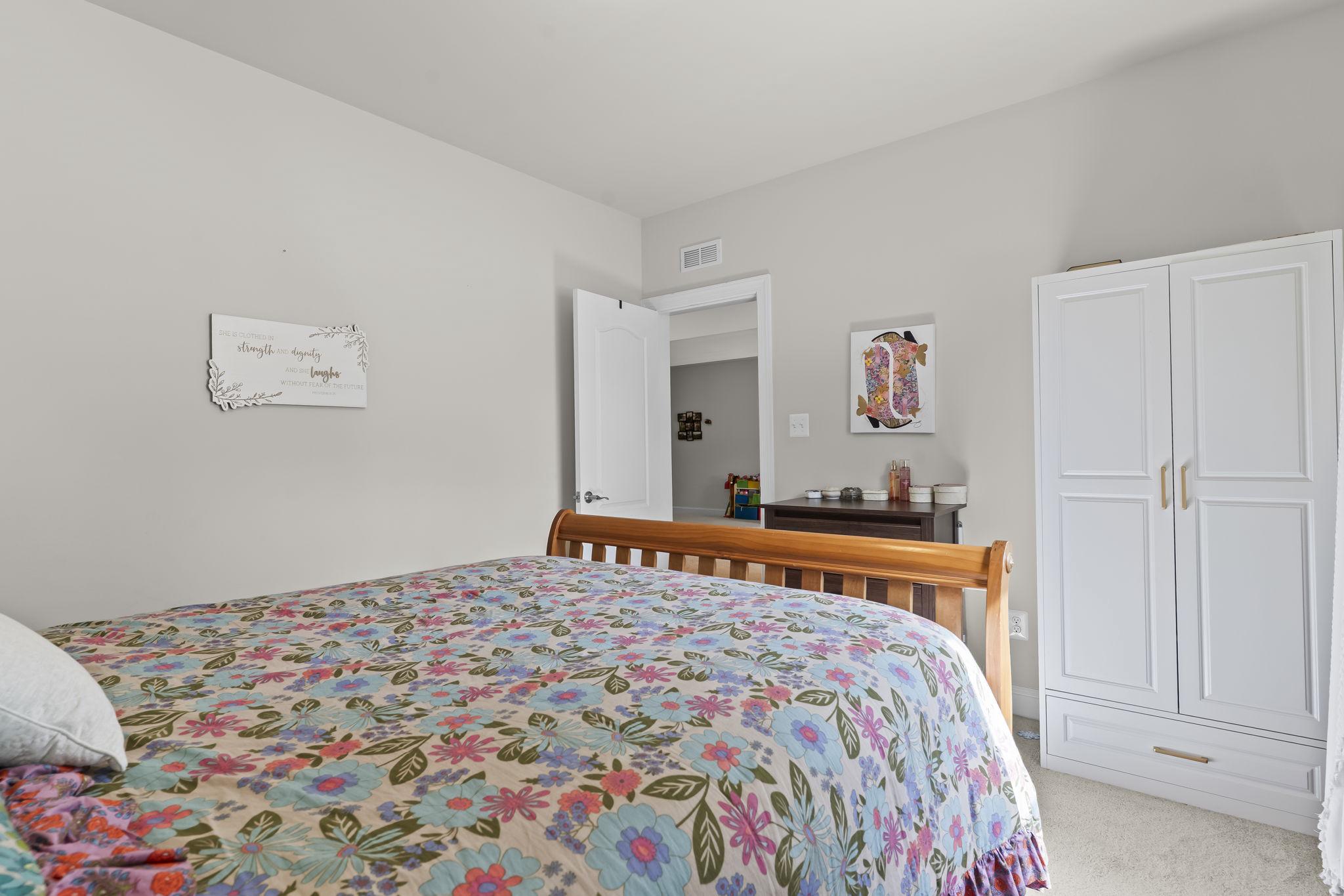 1905 Resting Ridge Lane Prince Frederick, MD 20678 - Photo 53 of 91 a bedroom with a bed and a dresser in it