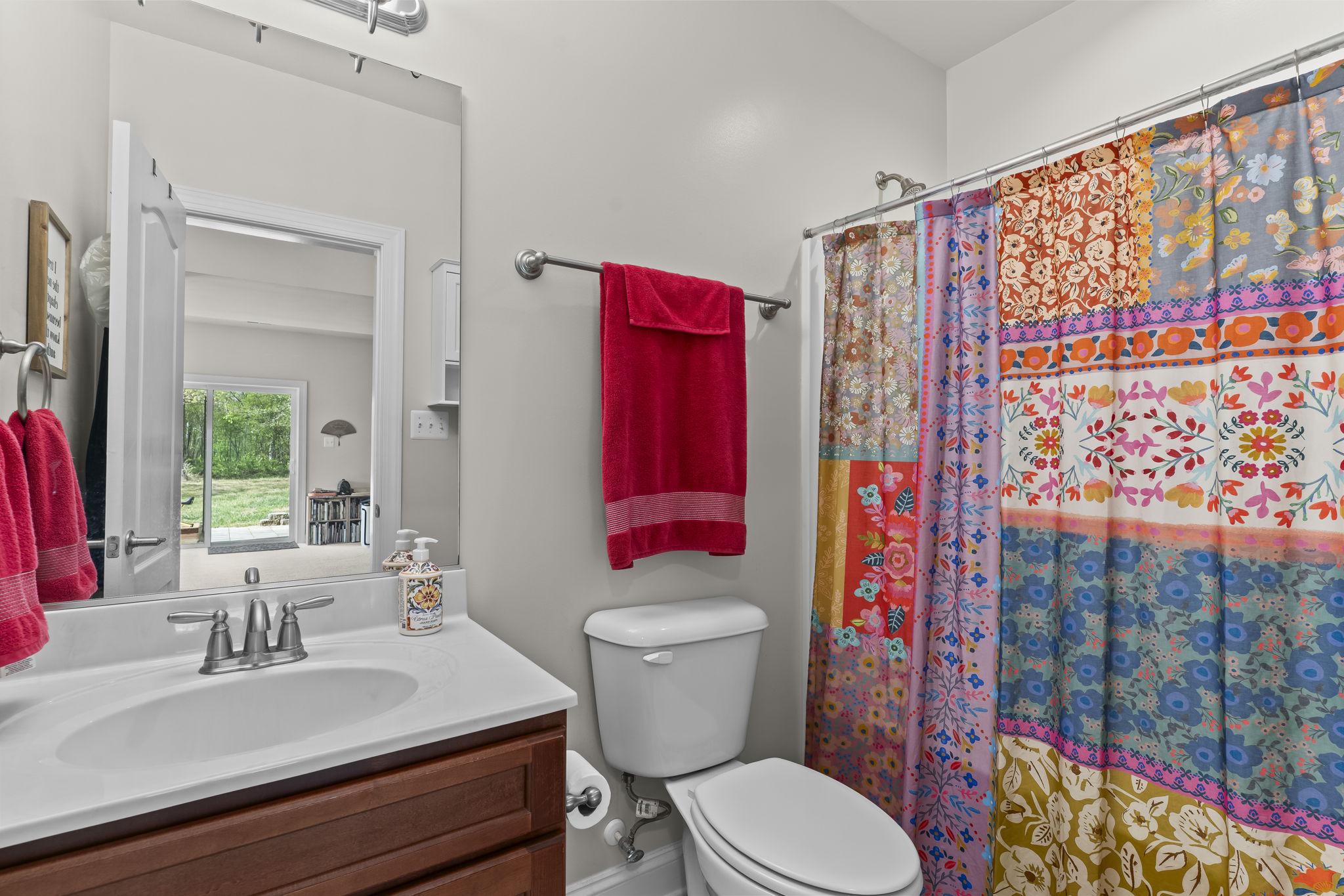 1905 Resting Ridge Lane Prince Frederick, MD 20678 - Photo 54 of 91 a bathroom with a sink toilet and shower
