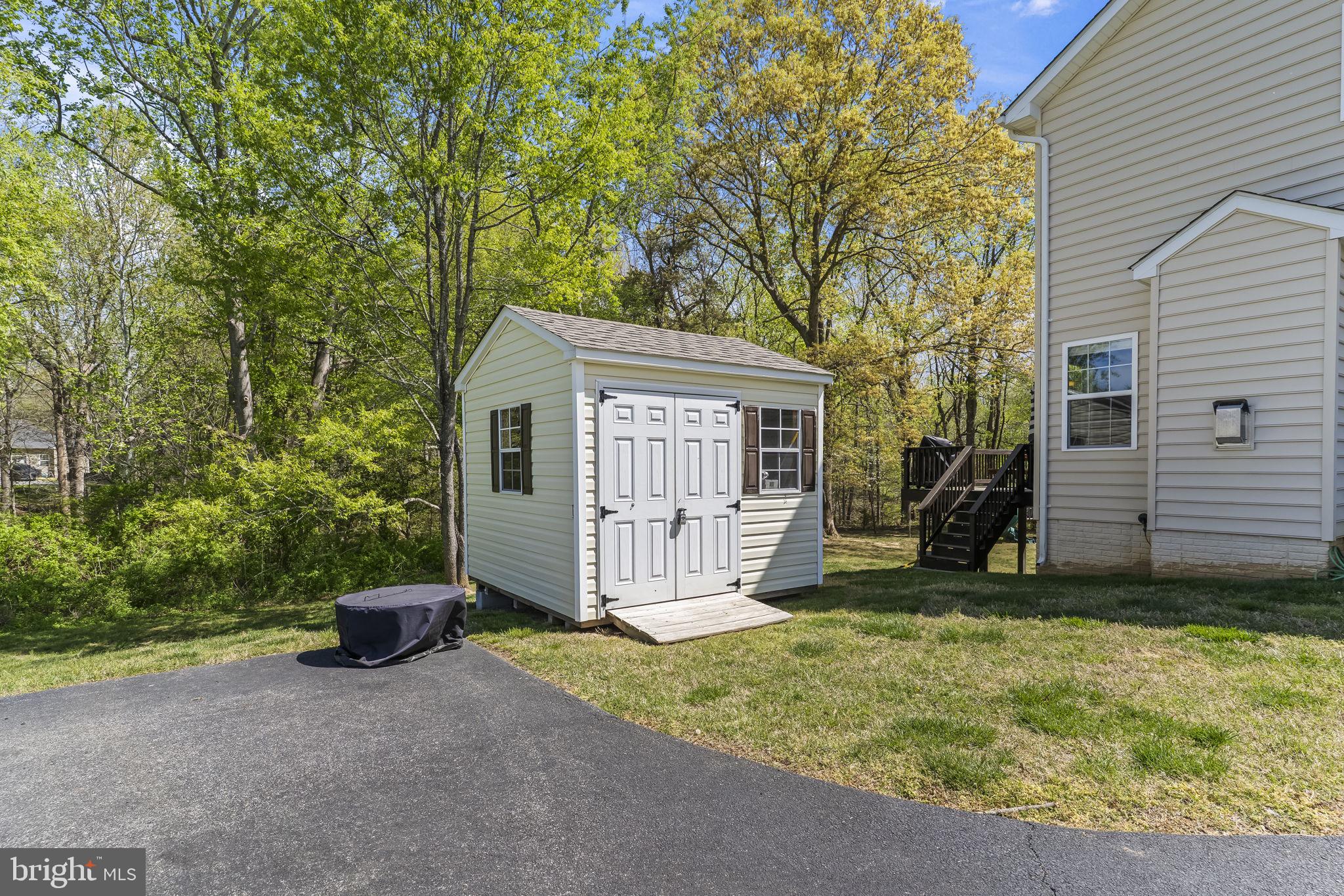 1905 Resting Ridge Lane Prince Frederick, MD 20678 - Photo 61 of 91 a view of a house with a yard and large tree