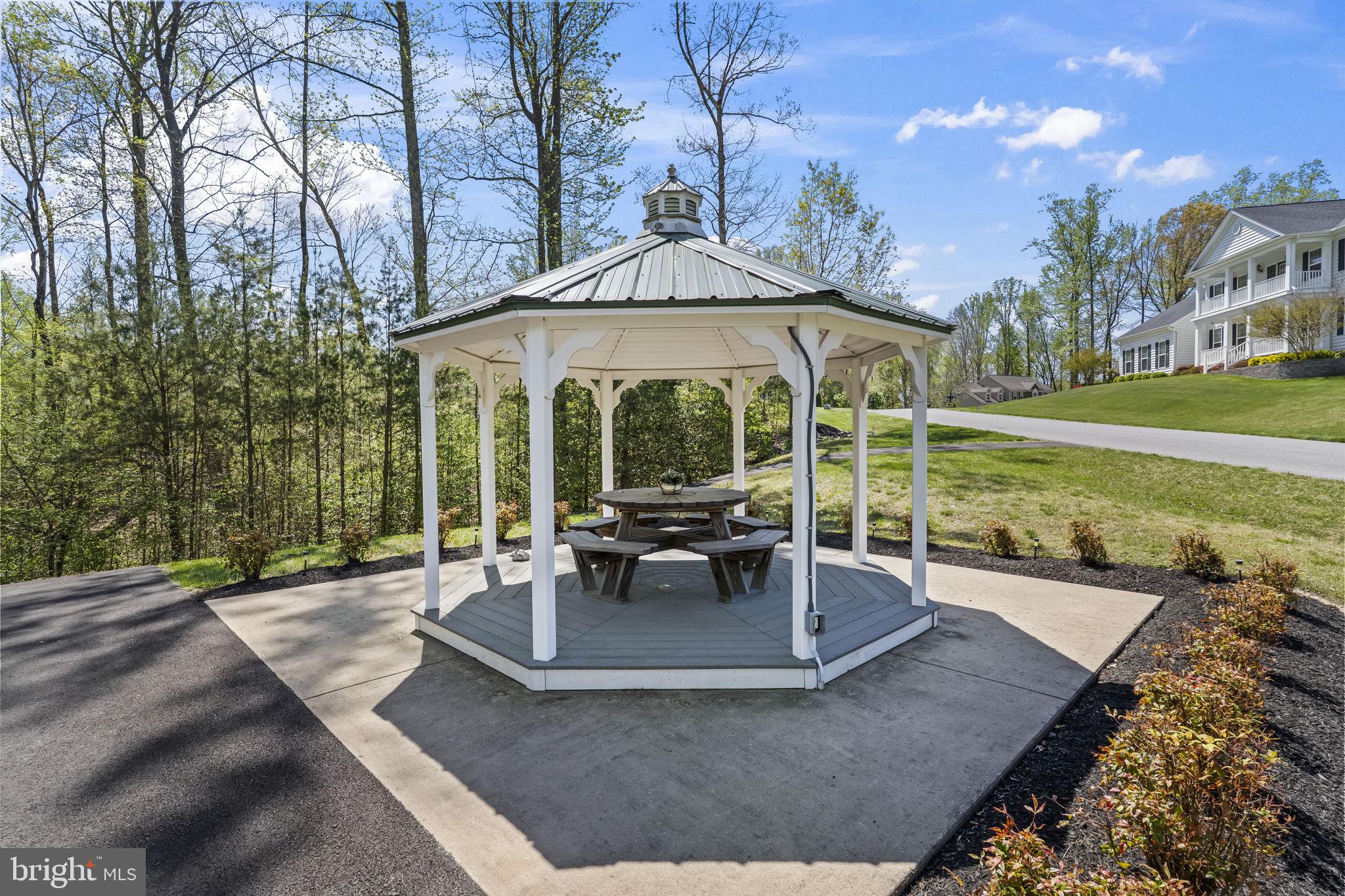 1905 Resting Ridge Lane Prince Frederick, MD 20678 - Photo 77 of 91 a view of a house with backyard sitting area and garden