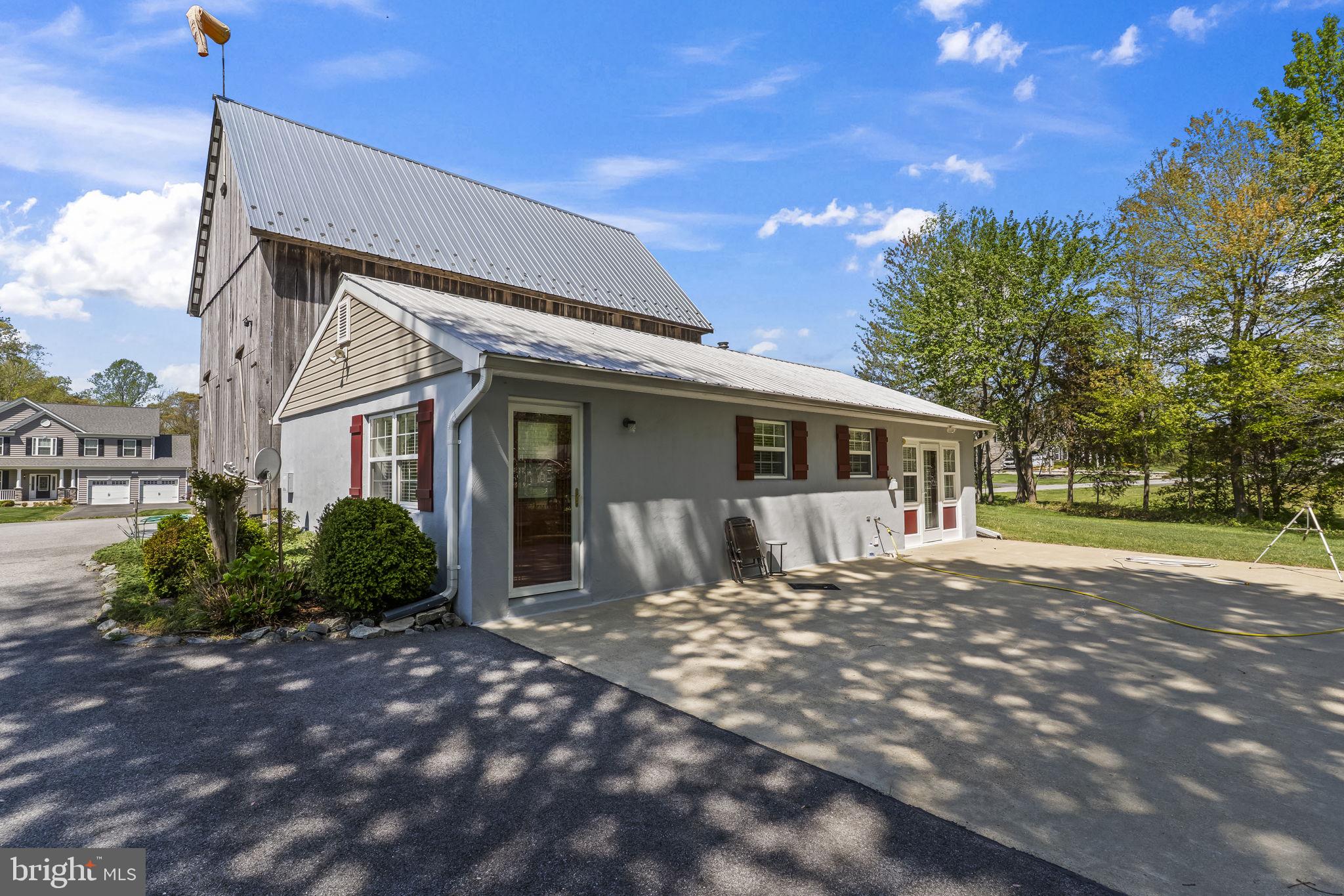 1905 Resting Ridge Lane Prince Frederick, MD 20678 - Photo 79 of 91 a front view of a house with a garden