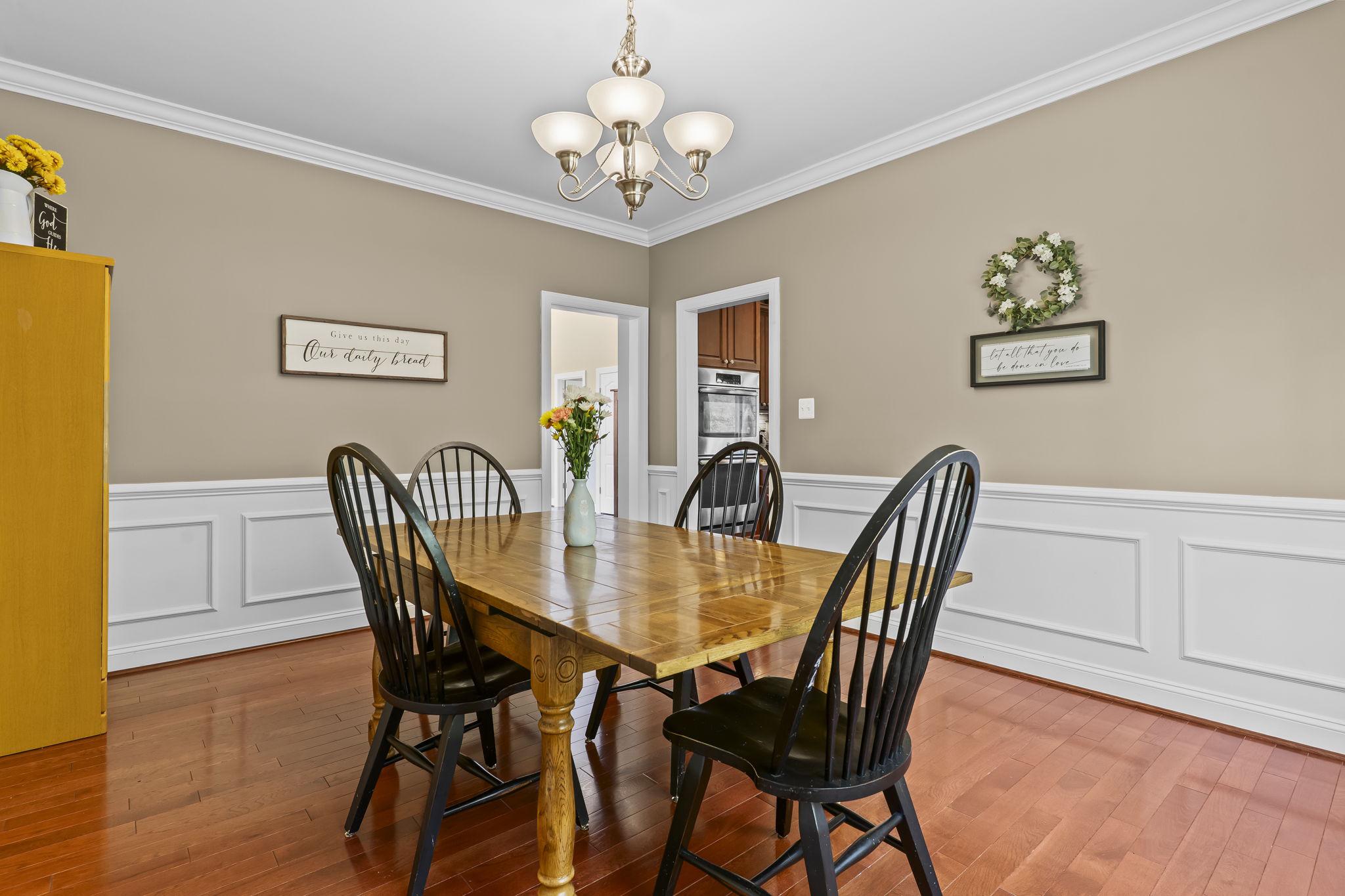 1905 Resting Ridge Lane Prince Frederick, MD 20678 - Photo 8 of 91 a view of a dining room with furniture and wooden floor