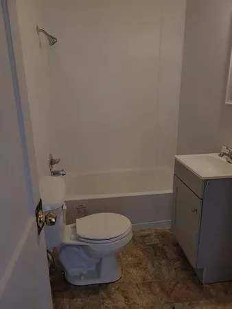 a bathroom with a toilet and a sink