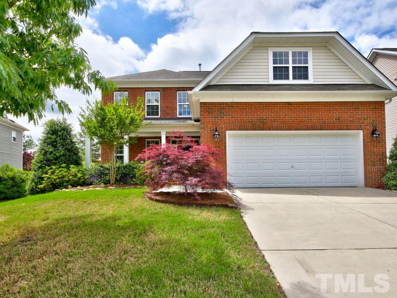 5304 Jade Forest Trail Raleigh, NC 27616 - Photo 1 of 22 a front view of a house with a garden and plants