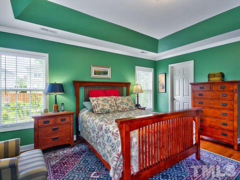 5304 Jade Forest Trail Raleigh, NC 27616 - Photo 11 of 22 a bedroom with a bed and windows