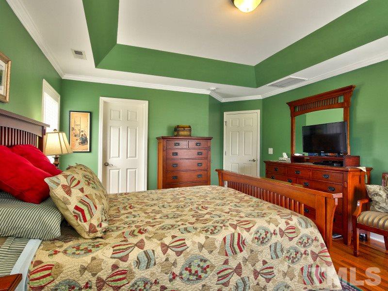 5304 Jade Forest Trail Raleigh, NC 27616 - Photo 12 of 22 a bedroom with a bed and a flat screen tv