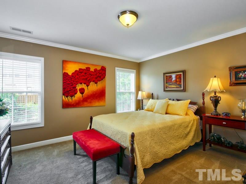 5304 Jade Forest Trail Raleigh, NC 27616 - Photo 15 of 22 a bedroom with a bed and dresser