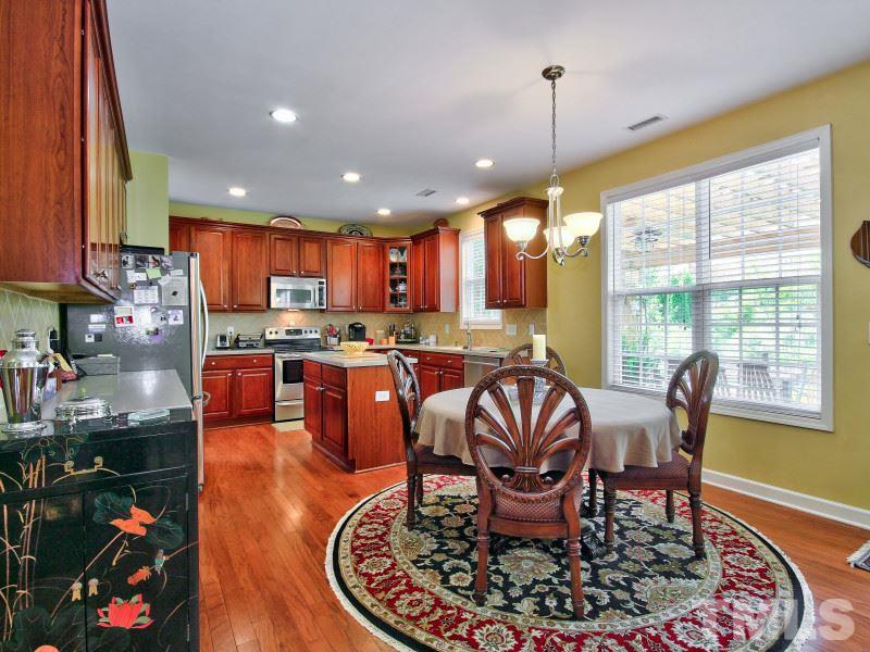 5304 Jade Forest Trail Raleigh, NC 27616 - Photo 19 of 22 a living room with dining room and kitchen view