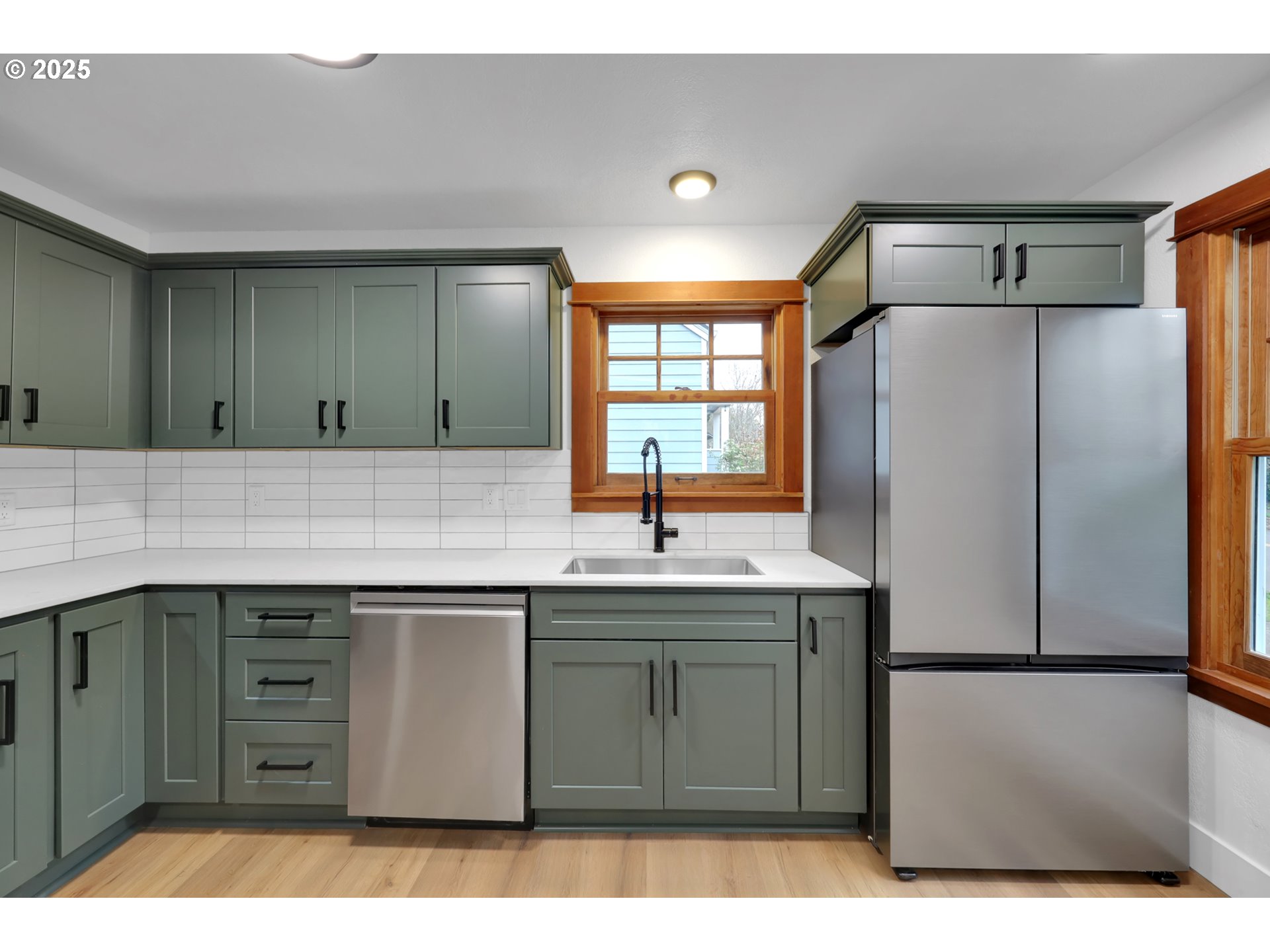 2121 Jefferson Street Eugene, OR 97405 - Photo 12 of 35 a kitchen with a sink a refrigerator and window