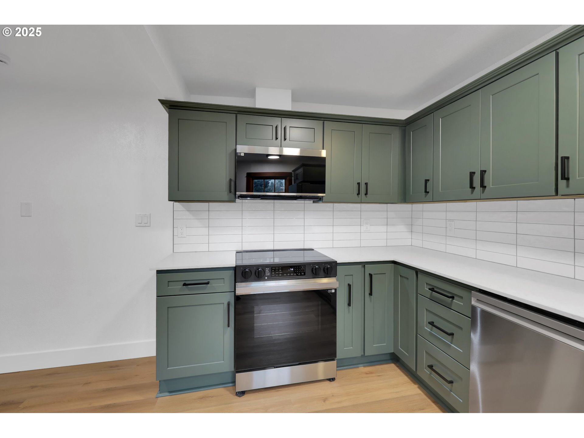 2121 Jefferson Street Eugene, OR 97405 - Photo 15 of 35 a kitchen with stainless steel appliances granite countertop a sink stove and microwave