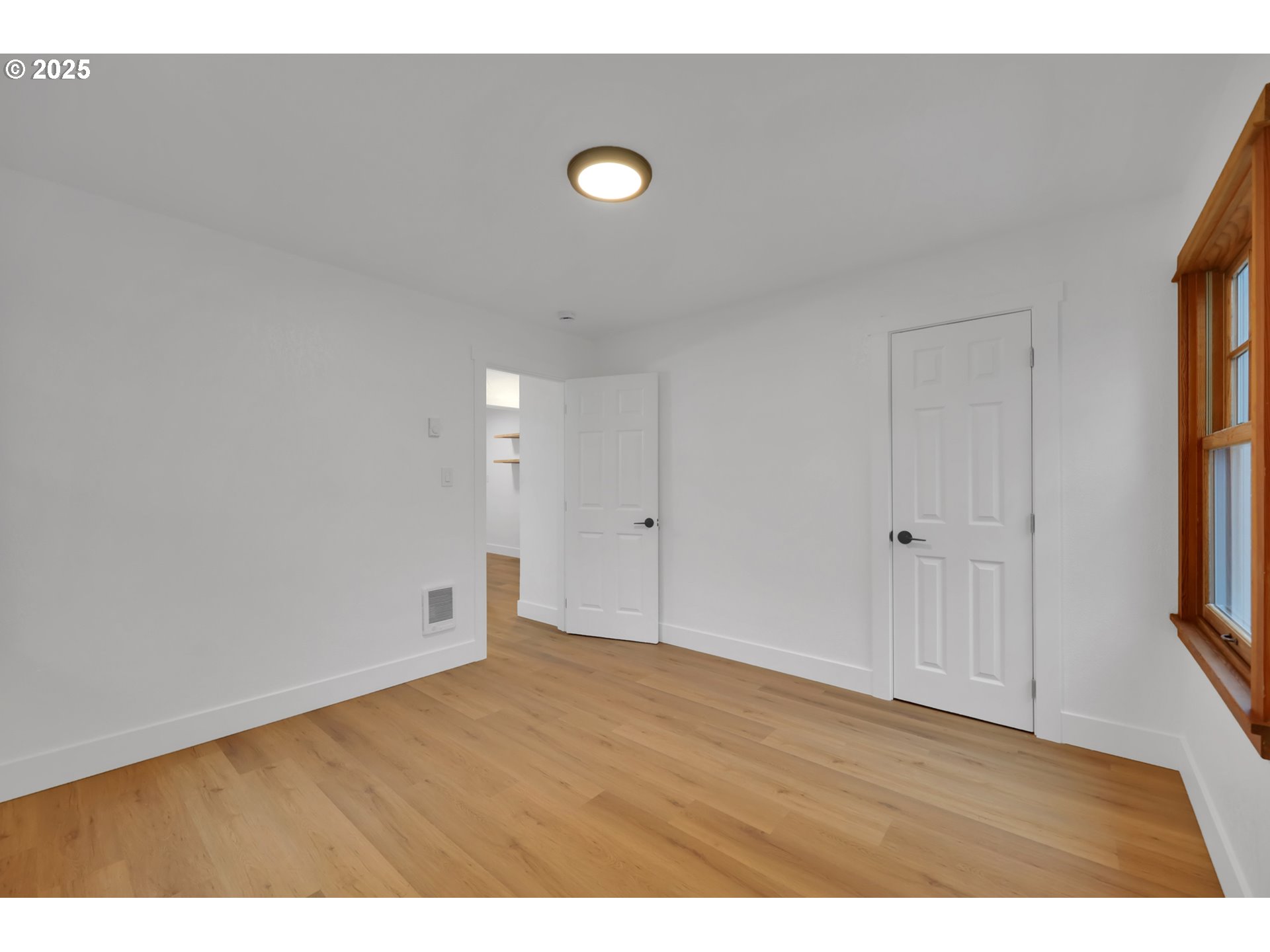 2121 Jefferson Street Eugene, OR 97405 - Photo 21 of 35 a view of an empty room and wooden floor