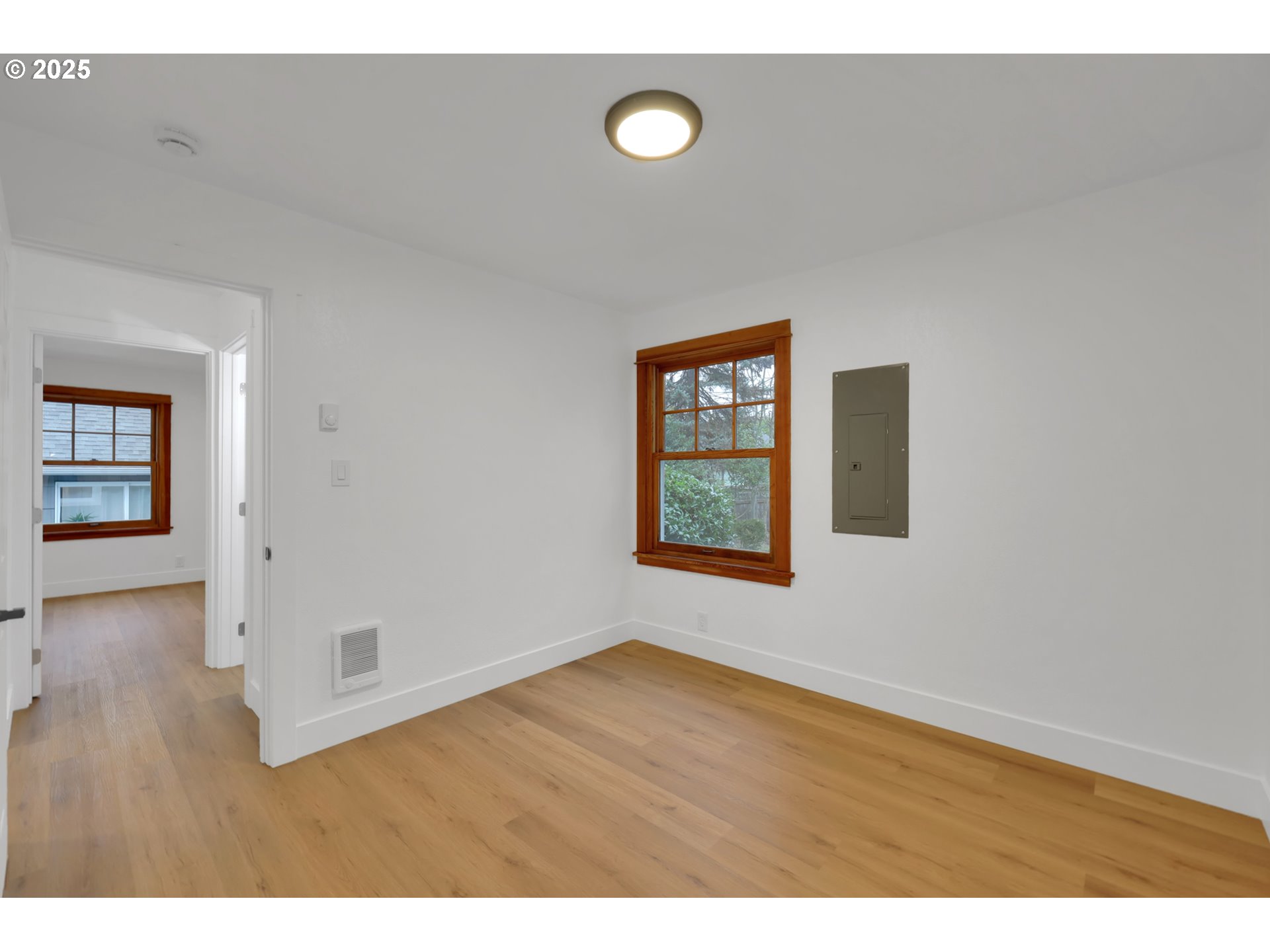 2121 Jefferson Street Eugene, OR 97405 - Photo 23 of 35 a view of an empty room with wooden floor and a window