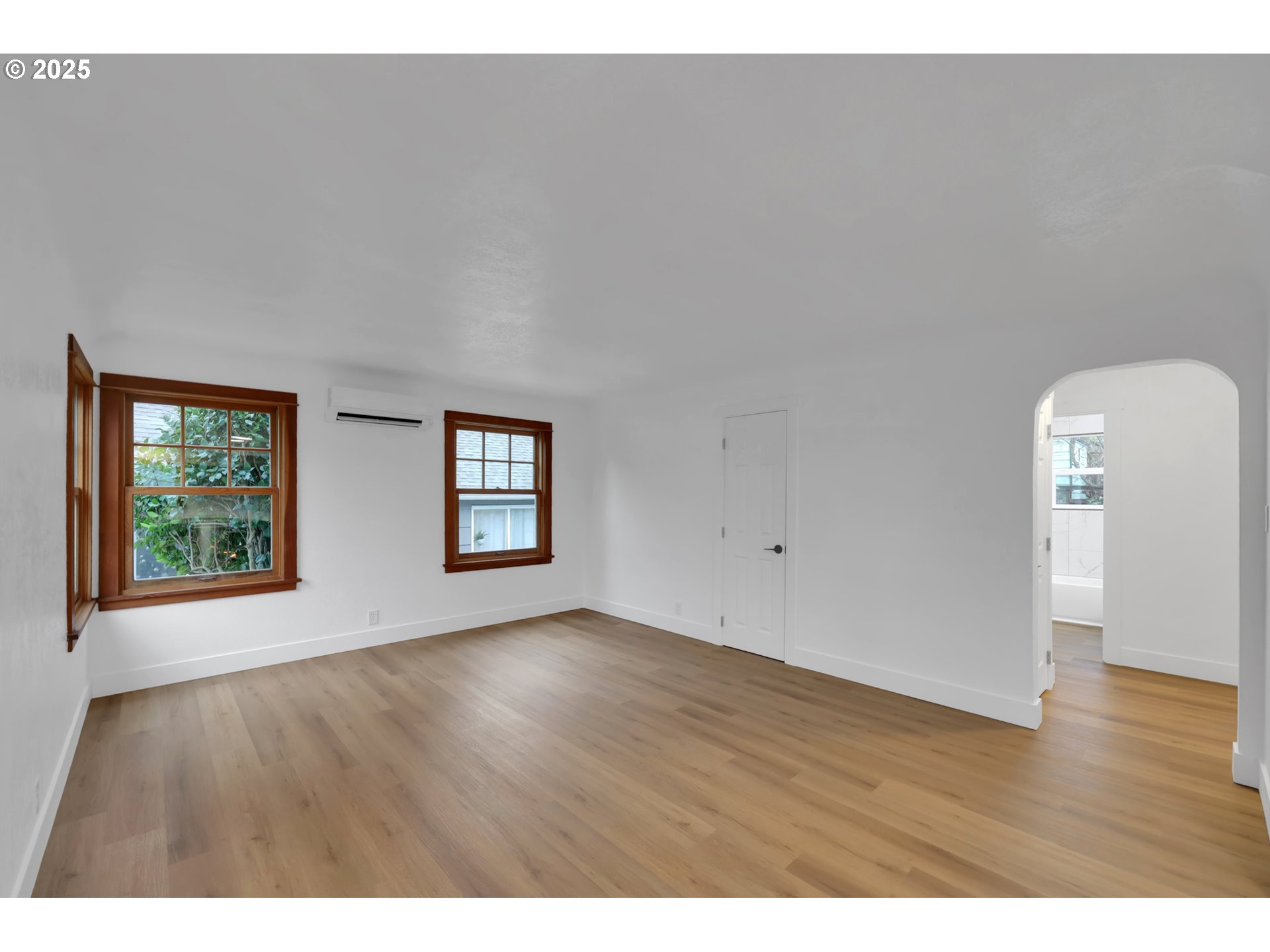 2121 Jefferson Street Eugene, OR 97405 - Photo 6 of 35 a view of an empty room with wooden floor and a window