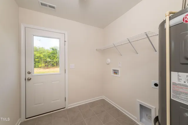 a bathroom with a sink a toilet a mirror a vanity and shower