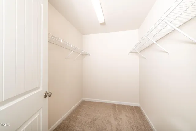 a bathroom with a shower sink vanity mirror and toilet