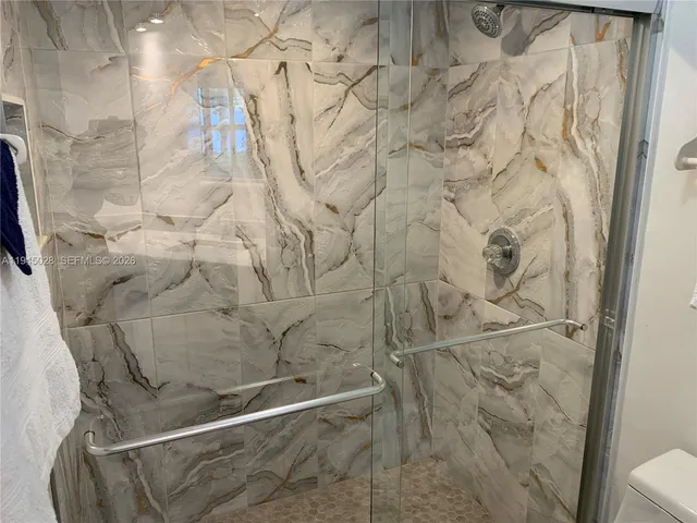 a front view of house with yard and car parked