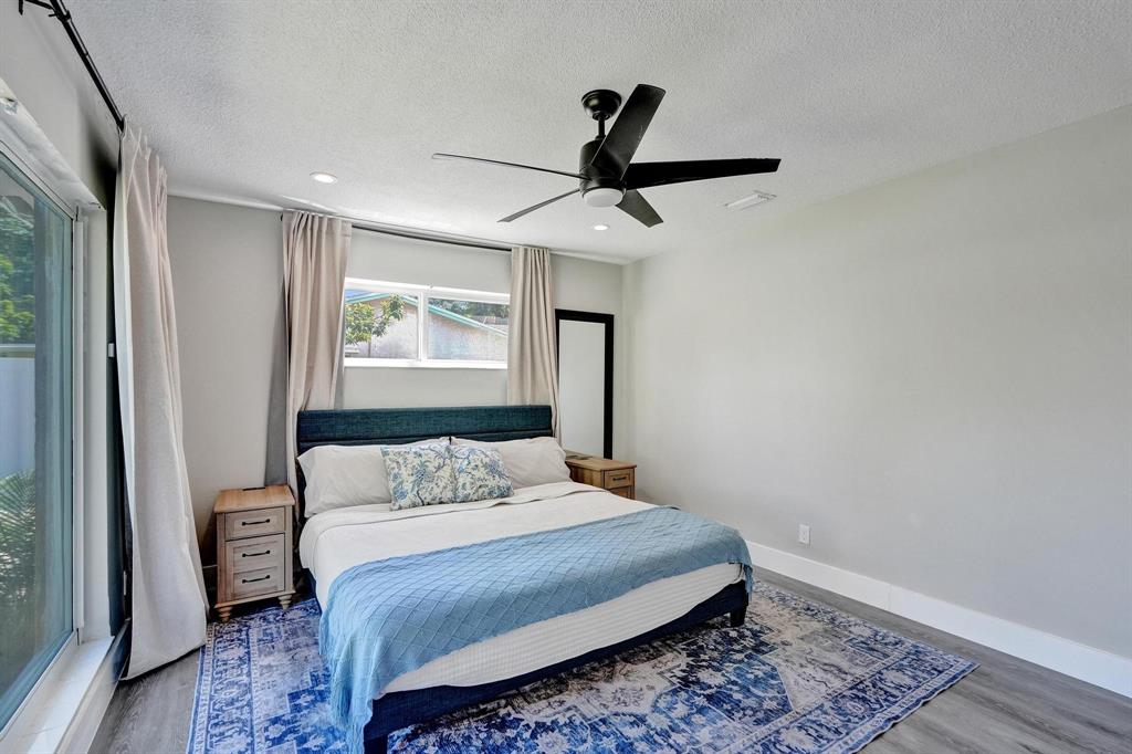 6411 Southwest 6th Street Margate, FL 33068 - Photo 21 of 48 a bedroom with a bed and a window