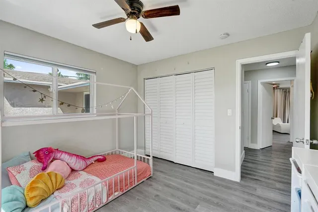 a bed room with a bed and a walk in closet