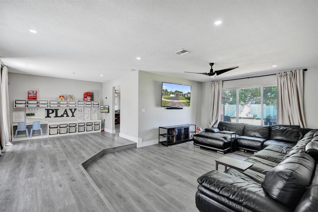 6411 Southwest 6th Street Margate, FL 33068 - Photo 3 of 48 a living room with furniture and a large window